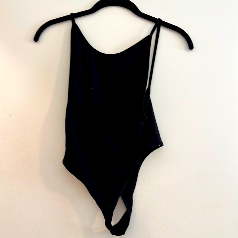 Black low cut body suit - low back and sides. Never worn!